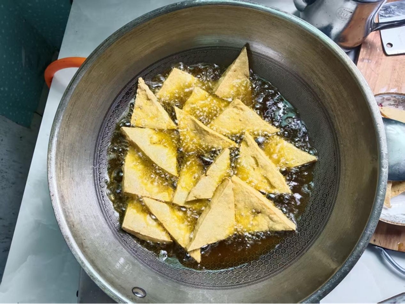 融入生活，成为“家乡味”。冉光友摄